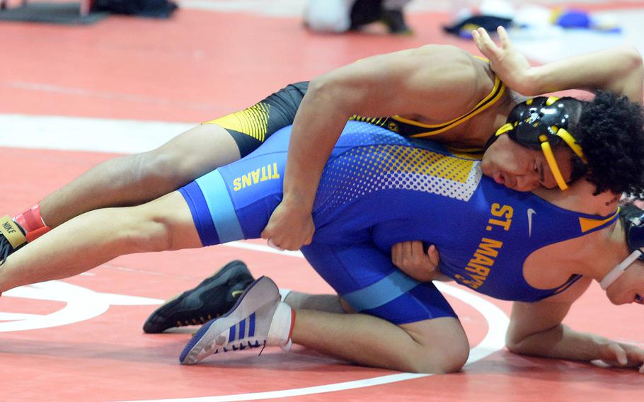 Kadena's Jeremiah Drummer gets the victory in the 180-pound Far East final over St. Mary's Matthew Araya.