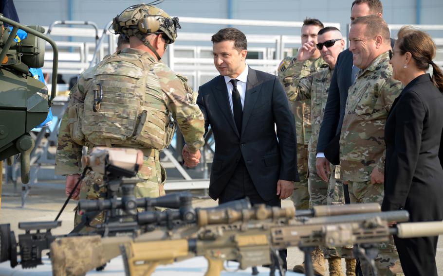 Ukraine President Volodymyr Zelenskyy inspects tactical equipment during a visit to the California Air National Guard at Moffett Air National Guard Base, Sept. 2, 2021.