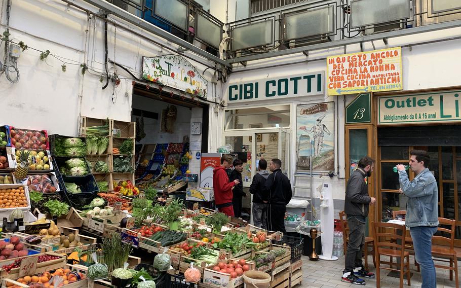 Cibi Cotti "Nonna Anna" offers traditional Neapolitan cooking with a cafeteria-style setup. It's located along a covered walkway that includes a market in Naples' Quartieri Chiaia. 