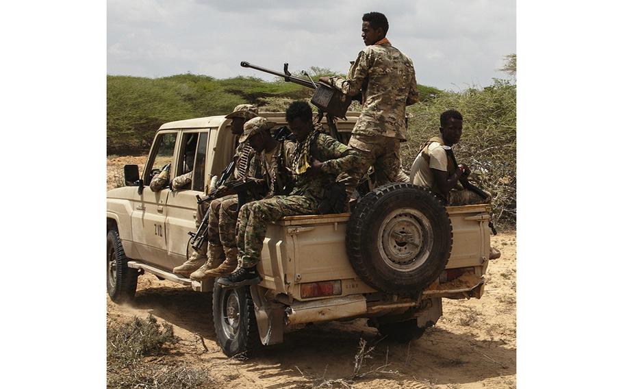 A Danab vehicle travels in Masjid Ali Guduud, an area recently taken back from al-Shabab control by the military in Somalia. 