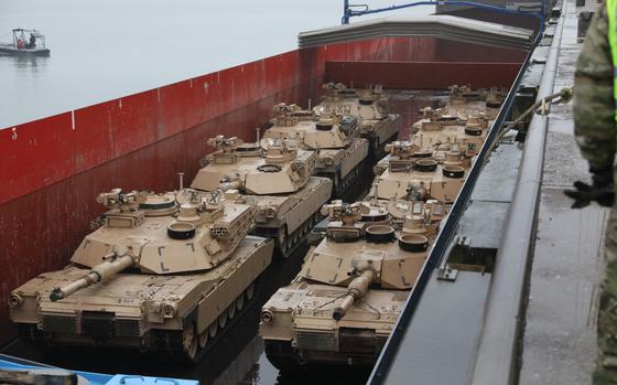 2nd Armored Brigade Combat Team, 1st Cavalry Division’s M1A2 Abrams tanks prepare for onward movement through Europe on a barge at Vlissingen, Netherlands Oct. 12 2019 in support of Atlantic Resolve. Since April 2014, U.S. Army Europe has led the U.S. Department of Defense’s Atlantic Resolve land efforts by bringing units based in the U.S. to Europe for nine months at a time. (U.S. Army photo by Sgt. Jesse Pilgrim)