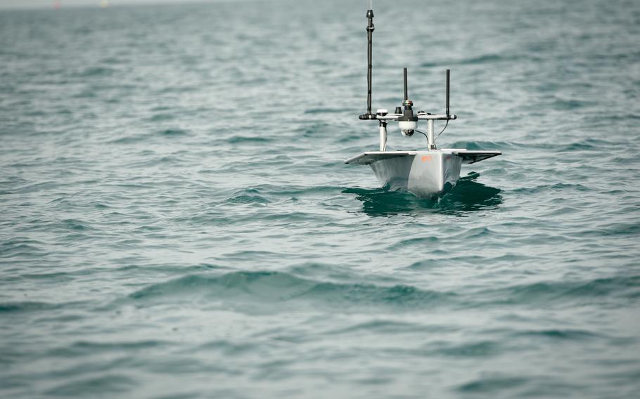 The Seasats X3, an unmanned surveillance craft, skims the waters of the Persian Gulf, Nov. 30, 2022 as part of a 5th Fleet exercise. The small ship can carry payloads for reconnaissance, electronic warfare and ocean mapping.