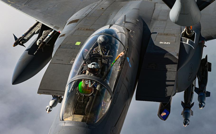 An F-15E Strike Eagle crew is refueled by a KC-135R Stratotanker during exercise Ample Strike 2021 near Pardubice Airport, Czech Republic. Qualifying fighter pilots can earn up to $420,000 in cash incentives when they extend their active-duty contracts for eight to 12 years.