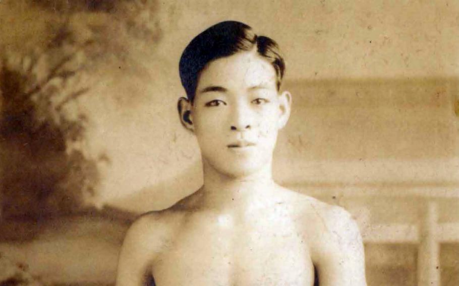 This photo of a Japanese man with a wooden sword was among five sent home from the Marshall Islands by a U.S. Marine during World War II. 