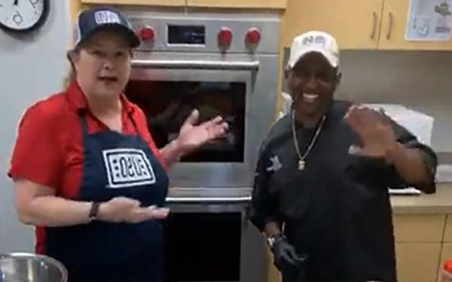 During a “Cooking Live With Julie” segment for the Greater Jacksonville Area USO Healthy Military Families Initiative, Julie Davis (left) welcomes a guest, Chef Amadeus, winner of a Food Networks Extreme Chef competition.