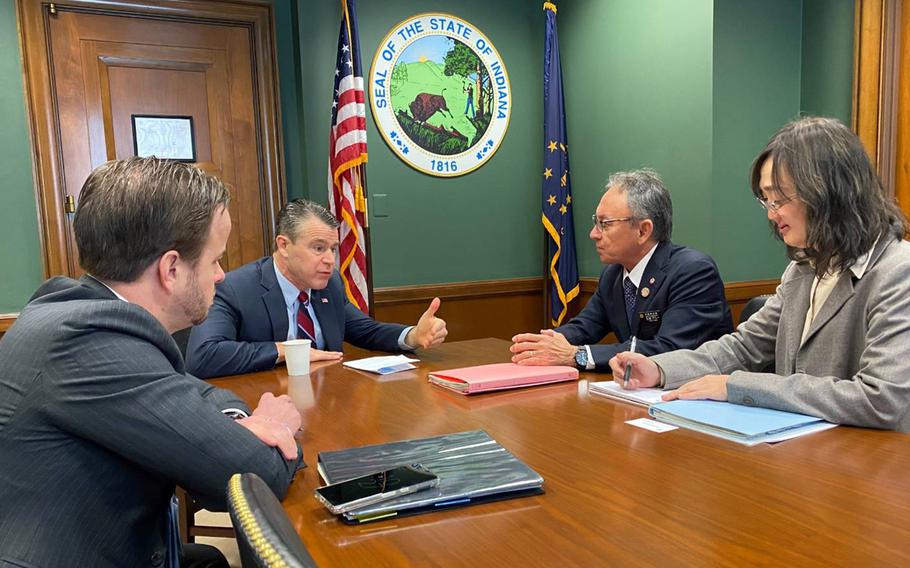 Okinawa Gov. Denny Tamaki, second from right, meets with Sen. Todd Young, R-Ind., second from left, in Young's Capitol Hill office, Wednesday, March 8, 2023.
