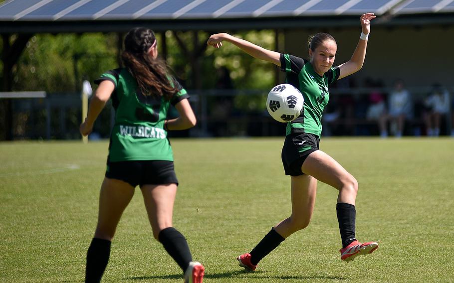 Naples defender Sonja Gottlieb controls the ball while fellow defender Mattivi Keilah follows during the first day of pool-play action against Black Forest Academy at the 2025 Division II DODEA European championships at the stadium of VfB Reichenbach on May 19, 2025, in Reichenbach-Steegen, Germany.