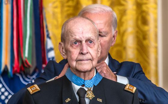Vietnam veteran Larry Taylor tries to hold back tears as President Joe Biden places the Medal of Honor around his neck during a ceremony at the White House on Tuesday, Sept. 5, 2023.
