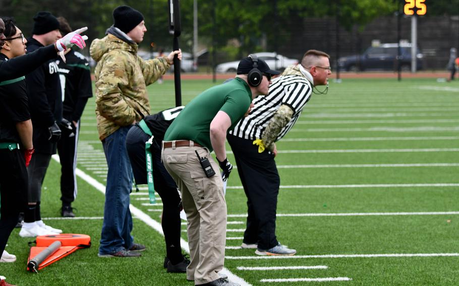 The U.S. Air Forces sideline gets ready for the snap of the football during a flag football game at RAF Lakenheath on Friday.