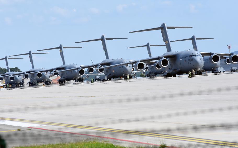U.S. Air Force C-17 aircraft are lined up on the runway at Ramstein Air Base, Germany, on Saturday, Aug. 21, 2021. The long-haul transport planes have been carrying the bulk of evacuees from Afghanistan to forward staging locations such as Qatar and Ramstein.