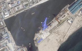This satellite image from Planet Labs PBC shows a blue tarp covering a North Korean destroyer after it suffered a failed launch while it was being put to sea in Chongjin, North Korea, Friday, May 23, 2025. (Planet Labs PBC via AP)
