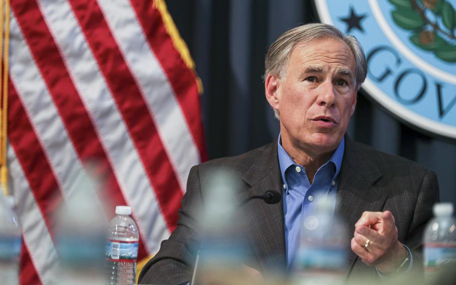 Gov. Greg Abbott holds a security briefing in Austin, Texas, in July 2021. Abbott on Saturday, Dec. 18, announced that a state-funded wall was being built along the border with Mexico.