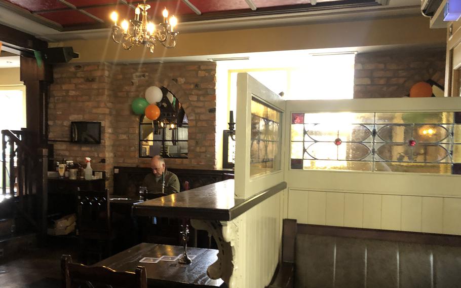 Inside Waxy’s Irish Pub in downtown Frankfurt, Germany. The interior is a lot of warm wood and leather.