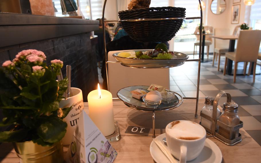 Breakfast comes served on a stack of plates and a basket at Cafe Hinz, a small restaurant and bakery in Kaiserslautern, Germany, Feb. 7, 2022. Cafe Hinz opened for breakfast seven days a week last spring.