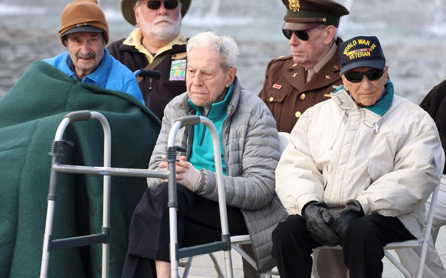 World War II veterans Robert Marovelli, George Armstrong and Frank Cohn, front left to right, were among six veterans of that conflict honored during a Veterans Day ceremony at the National World War II Memorial in Washington, D.C., November 11, 2023.