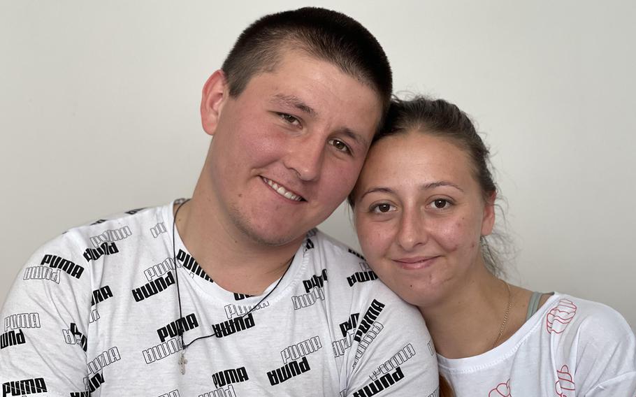 Oksana Balandina (right), who lost both legs to a mine, danced with her new husband, Viktor Vasyliv, at their hospital wedding in Lviv, in western Ukraine.