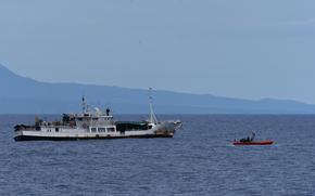 Samoan shipriders and a law enforcement team from U.S. Coast Guard Cutter Harriet Lane (WMEC 903) prepare to board a foreign-flagged fishing vessel in Samoa’s exclusive economic zone July 14, 2024. Through bilateral maritime law enforcement agreements, the Coast Guard provides a platform for partner nations to enforce domestic and international laws within territorial seas and the far reaches of their EEZs. (U.S. Coast Guard photo, courtesy Cutter Harriet Lane)