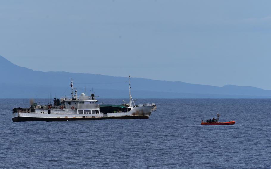 Samoan shipriders and a law enforcement team from U.S. Coast Guard Cutter Harriet Lane (WMEC 903) prepare to board a foreign-flagged fishing vessel in Samoa’s exclusive economic zone July 14, 2024. 