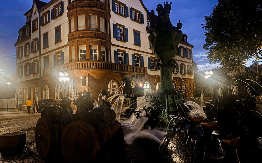 The whimsical waterworks of the Kaiserbrunnen enliven the square outside Curry House in downtown Kaiserslautern, Germany.