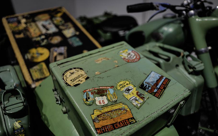 A Zundapp KS 601 motorcycle and Steib TR500 sidecar featuring stickers from Route 66 and other American landmarks at the German Motorcycle Museum in Neckarsulm, Germany. The motorcycle was used by photographer Eitel Lange for his 1953 round-the-globe journey.