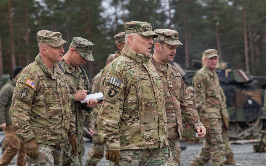 Gen. Mark Milley, chairman of the Joints Chiefs of Staff, center, walks with leaders responsible for training Ukrainian soldiers at the U.S. Army base in Grafenwoehr, Germany, on Monday, Jan. 16, 2023. Milley met with the Ukrainians and observed training during his visit.