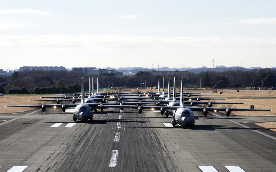 C-130J Super Hercules aircraft assigned to the 36th and 327th Airlift Squadrons prepare to take off at Yokota Air Base, Japan, Tuesday, Jan. 31, 2023. 