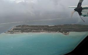 A Coast Guard HC-130 Hercules aircrew from Air Station Barbers Point successfully evacuated four Fish and Wildlife personnel off Johnston Atoll, Oct. 1, 2018. While Hurricane Walaka is far removed from large population centers it has become necessary to evacuate U.S. Fish and Wildlife personnel. (U.S. Coast Guard photo by Petty Officer 3rd Class Michael Griffin/Released)