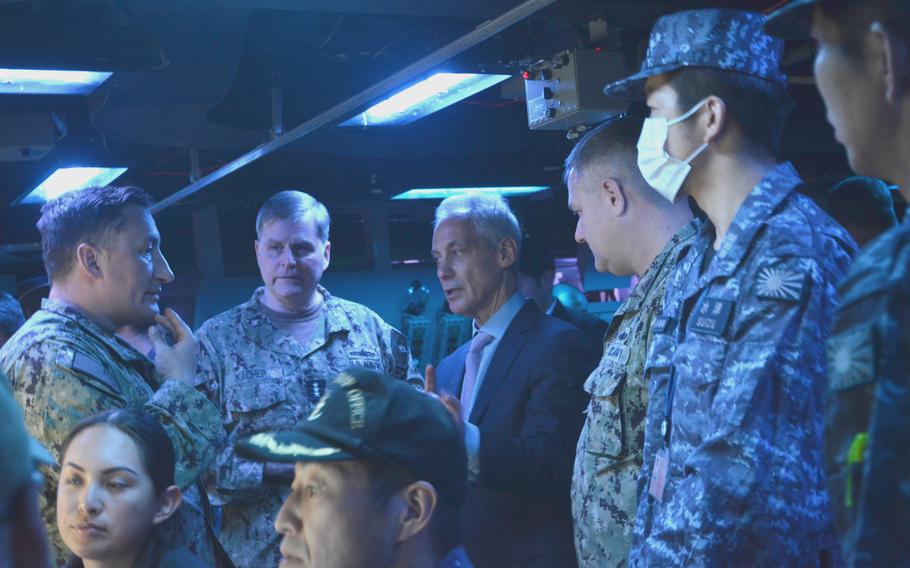 U.S. Ambassador to Japan Rahm Emanuel, center, discusses Tomahawk training with U.S. Navy and Japan Maritime Self-Defense Force personnel aboard the USS McCampbell at Yokosuka Naval Base, Japan, on March 28, 2024. 