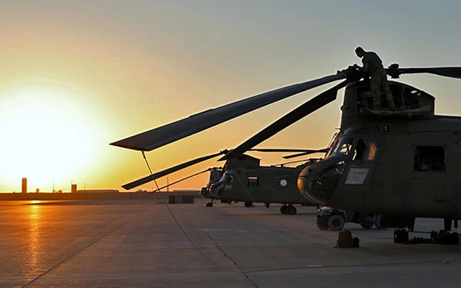 U.S. soldiers load cargo onto CH-47 Chinooks on Aug. 27, 2023, at al Asad Air Base in Iraq. A recent Reagan Institute poll of Americans showed that 31% of respondents think the Middle East is where the U.S. military should be focused, up from 11% a year earlier.