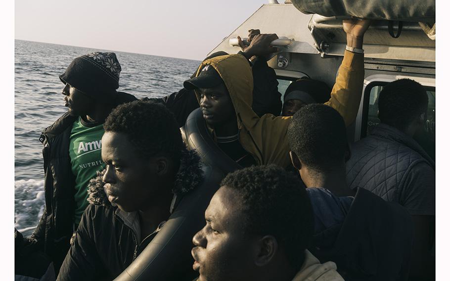 The Tunisian coast guard transports migrants after their boat was intercepted near Sfax, Tunisia, on May 27, 2023. 