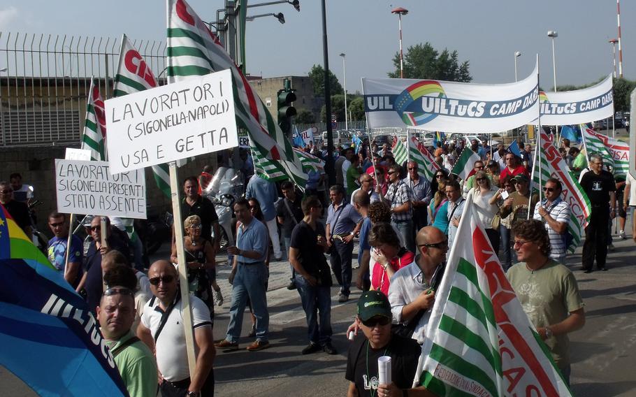 Italian employees from U.S. military bases in the country march to the front gate of the Capodichino base in Naples in 2010. A worker walkout could cause potential disruptions to base services this week after two unions representing 4,000 Italian workers announced a strike.