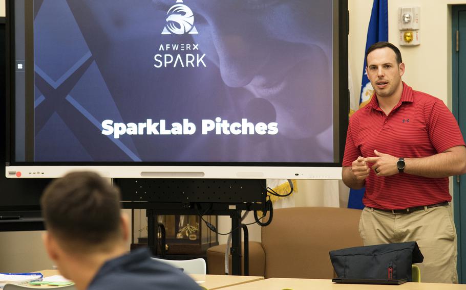 Capt. Colton McConnel, a Huey instructor pilot for the 459th Airlift Squadron, pitches an idea about 24-hour library access during an AFWERX-sponsored SparkLab workshop at Yokota Air Base, Japan, Friday, June 23, 2023.