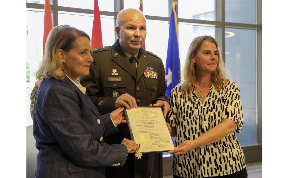 Maj. General Ray Shields presents the New York State Conspicuous Service Cross, to the niece and grand-niece of Pvt. John Greschiak 
