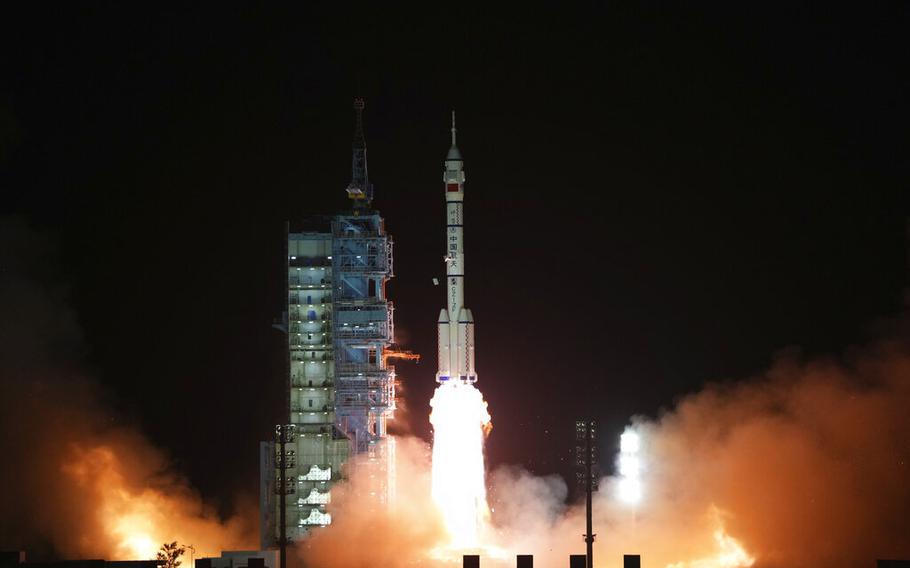In this photo released by Xinhua News Agency, the manned spaceship Shenzhou-15, atop the Long March-2F Y15 carrier rocket, blasts off from the Jiuquan Satellite Launch Center in northwestern China on Tuesday, Nov. 29, 2022.