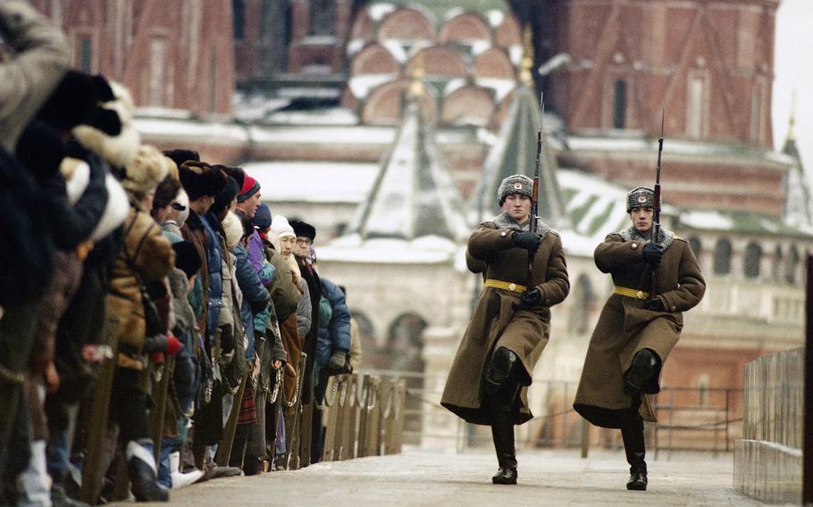 Soviet citizens watch honors guard soldiers during the changing of the guard at Lenin’s Mausoleum in Red Square, Moscow, Russia, on Dec. 11, 1991. On Dec. 8, 1991, the leaders of Russia, Ukraine and Belarus declared the USSR dead and announced the creation of the Commonwealth of Independent States, an alliance joined two weeks later by eight other Soviet republics. 