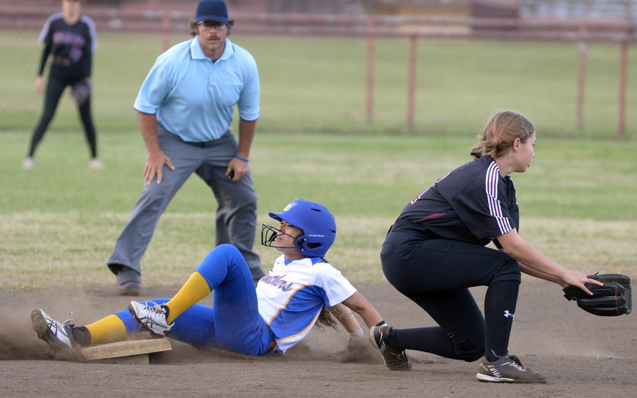 Yokota’s Cocoro Jones slides safely into second base past Zama’s Hailey Momerak during Tuesday’s DODEA-Japan softball game. The Panthers won 15-3.