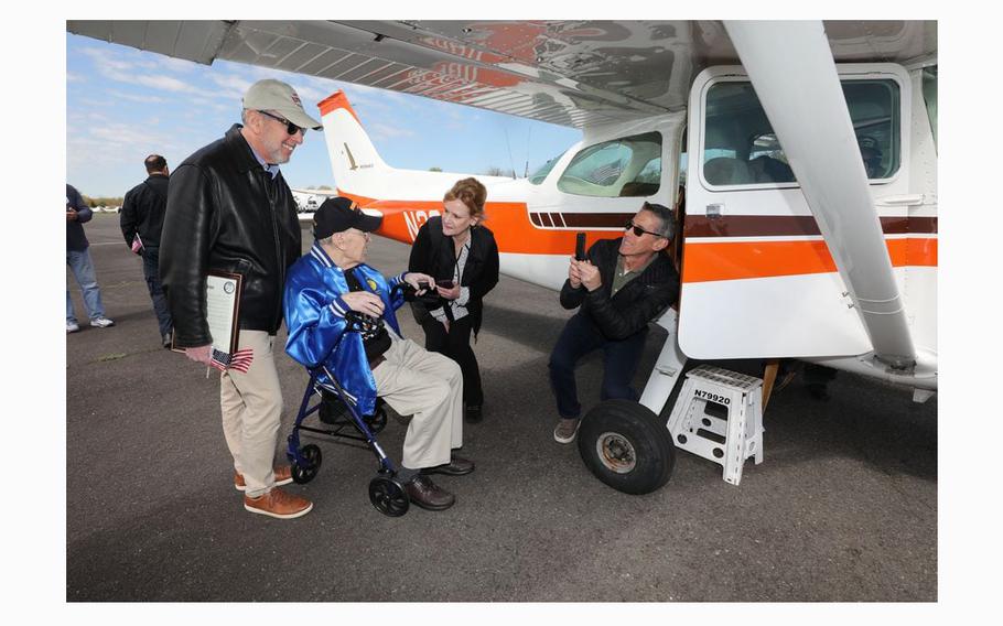 With his sons Howard, left, and Russel, right, and Life Enrichment Director at Brandywine Living Stephanie Gaber, Donald Stern, second from left, prepares to get into the plane, on Thursday, April 25 2024. He got to spend his 101st birthday with a flight from the Central Jersey Airport in Hillsborough to  the Statue of Liberty. The centenarian served in the Army Air Corp during World War II.