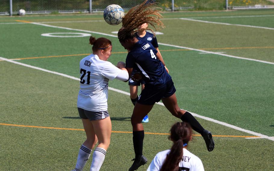 Osan's Tatiana Lunn and Humphreys' Elysia Koch go up to head the ball during Saturday's DODEA-Korea girls soccer match. The Blackhawks won 6-2.