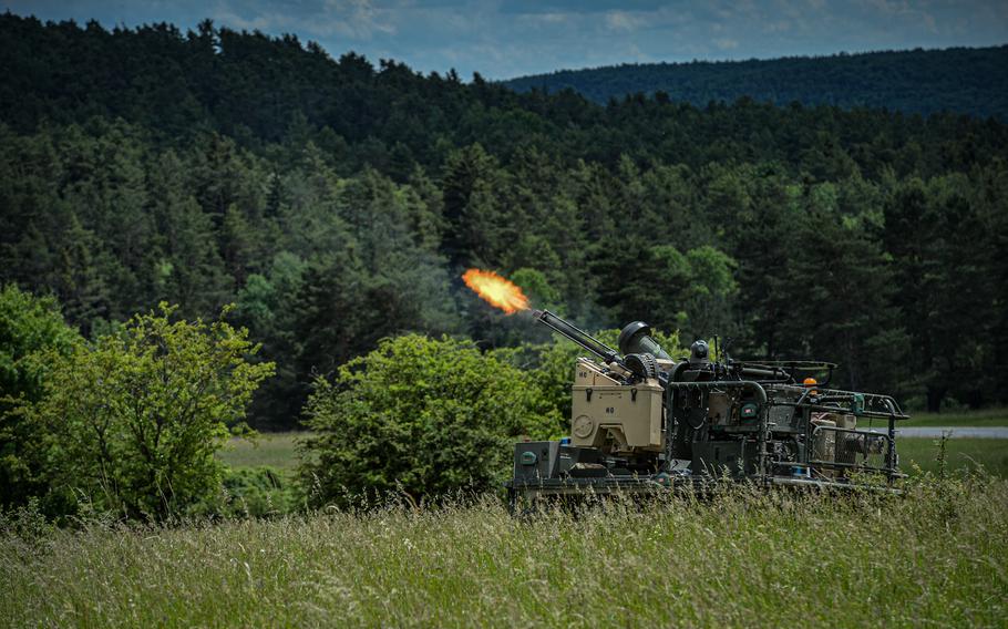 A Project Origin robotic combat vehicle fires .50-caliber weapon simulation rounds during a concept demonstration at the Joint Multinational Readiness Center in Hohenfels, Germany, June 8, 2022. Project Origin unmanned ground vehicles are designed to support Army maneuvers by providing a variety of weapons and sensor attachment packages and was tested and demonstrated during exercise Combined Resolve 17. 