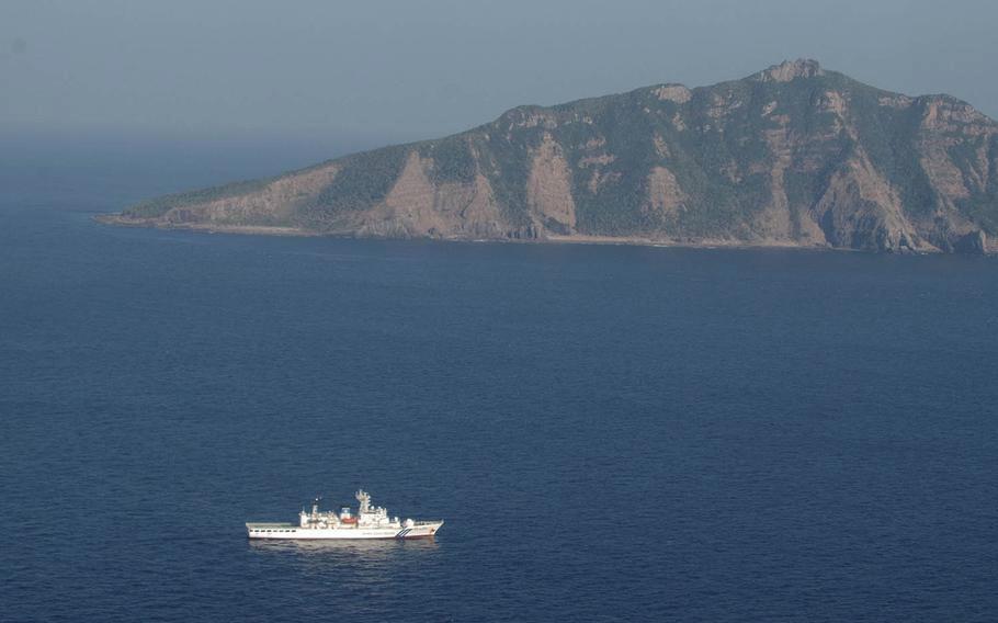 A Japanese coast guard vessel sails in the East China Sea near Uotsuri-jima, the largest island in the uninhabited Senkaku chain, in this undated photo.