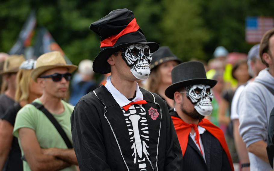 Peace activists wear skull masks and costumes during a protest against war in Ramstein-Miesenbach, Germany, June 25, 2022. Organizers called on participants to represent versions of death to criticize war profiteering and military actions in Europe and around the globe. 