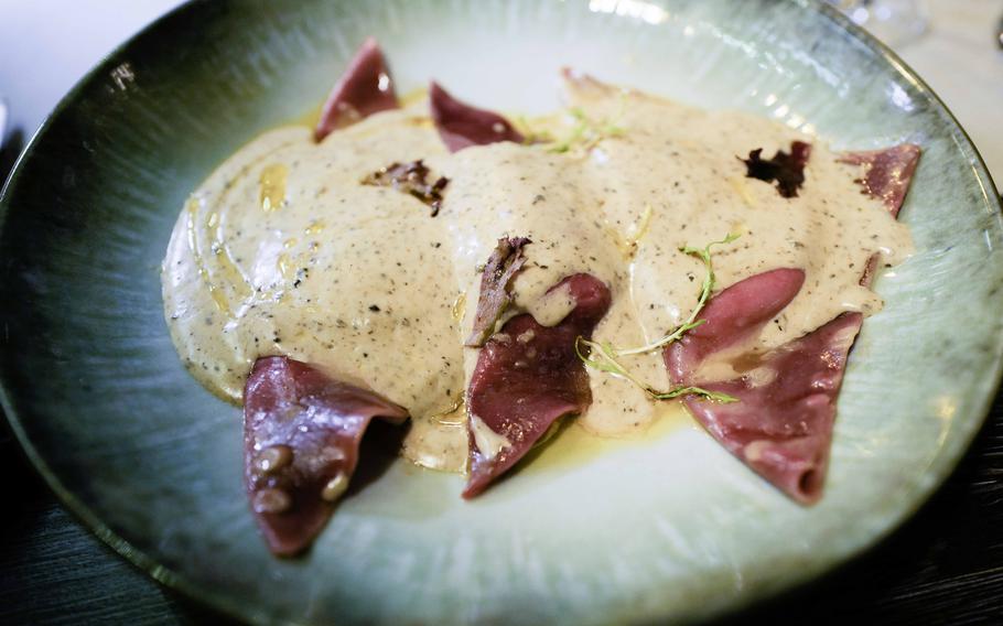 A plate of homemade vegetarian tortellini served at Grifo Restaurant in Kerzenheim, Germany, Jan. 10, 2024. The pasta is filled with ricotta cheese and served in a rich mushroom cream sauce, which is enhanced with a hint of truffle oil for a luxurious finish.