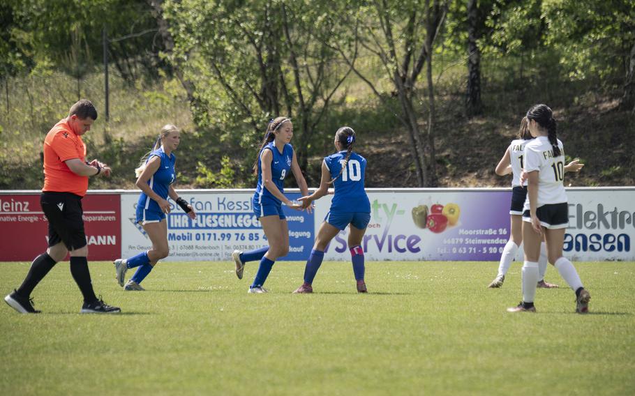 Rota Admirals junior Jourdan Timmons high fives junior Emma Montoya after a goal against the Bahrain Falcons during the Division II DODEA European Championships at Reichenbach-Steegen, Germany on May 20, 2025.