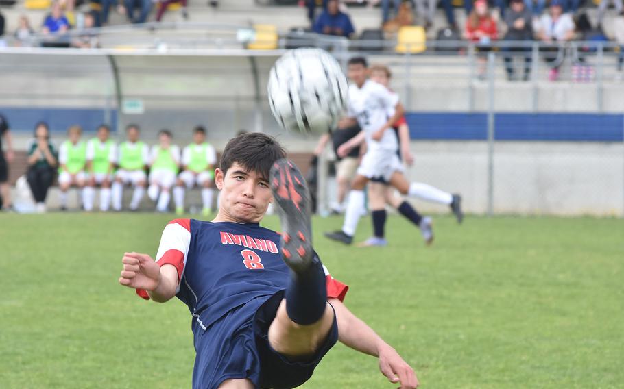 Aviano's Xavier Fox, who scored his team's first goal, kicks the ball back over his head toward the Naples goal in the Saints' 3-2 loss to the Wildcats on Saturday, April 16, 2022 in Aviano, Italy.