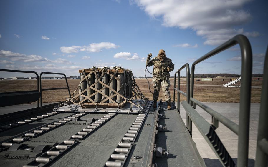 Airman Faith Grayson, 436th Aerial Port Squadron ramp operation specialist, loads cargo Feb. 3, 2023, during a security assistance mission at Dover Air Force Base, Del. 