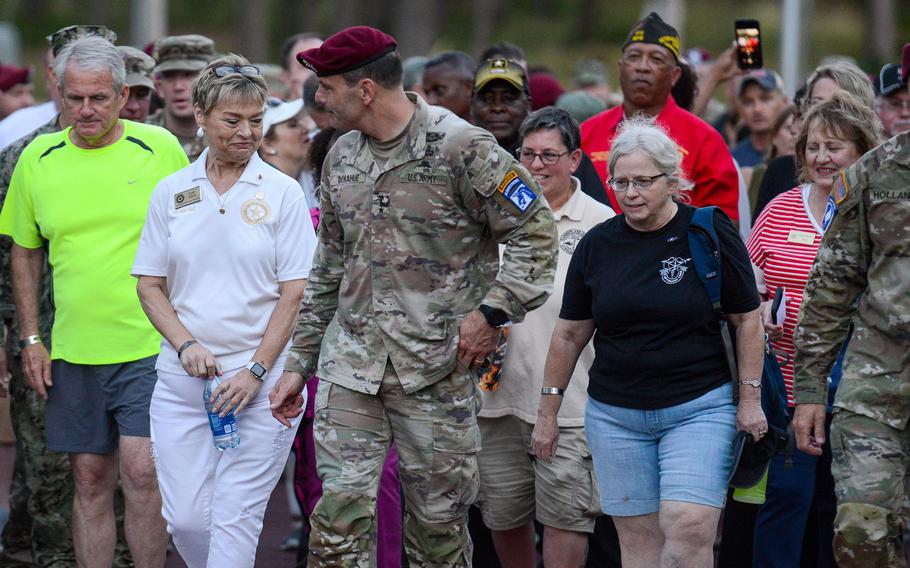 Lt. Gen. Chris Donahue leads the first-ever Sunset Liberty March on June 1, 2023, alongside Gold Star Mothers Patti Elliott, left, and Maureen Miller, right, at what was then Fort Bragg, N.C. The former Fort Bragg was renamed Fort Liberty the next morning. Elliot’s son Army Spc. Daniel Lucas Eliott was killed in Iraq in 2011. Miller’s son, Green Beret Staff Sgt. Robert Miller, was killed in Afghanistan in 2008 and posthumously received the Medal of Honor. 