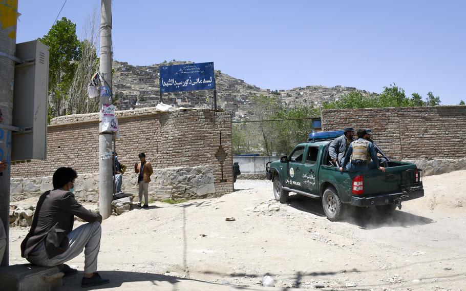 Police arrive at the Syed Al-Shahda school in the Dasht-e-Barchi neighborhood in west Kabul, Afghanistan on May 9, 2021. A bombing a day earlier struck schoolgirls as they left to go home, leaving at least 85 dead and 186 wounded.