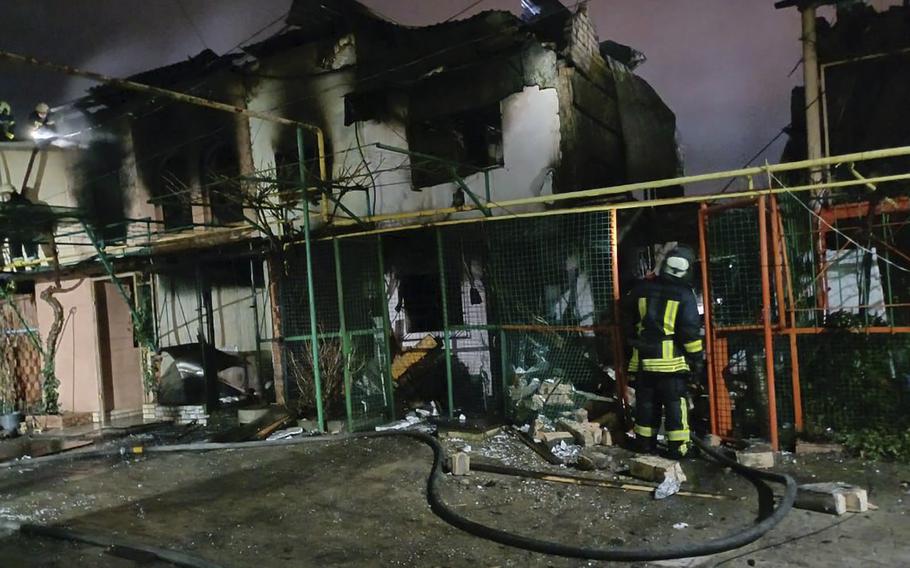 In this photo provided by the Odesa Regional Administration, firemen examine the site of the Russian rocket attack in the Odesa region, Ukraine, Wednesday, Dec. 27, 2023. 