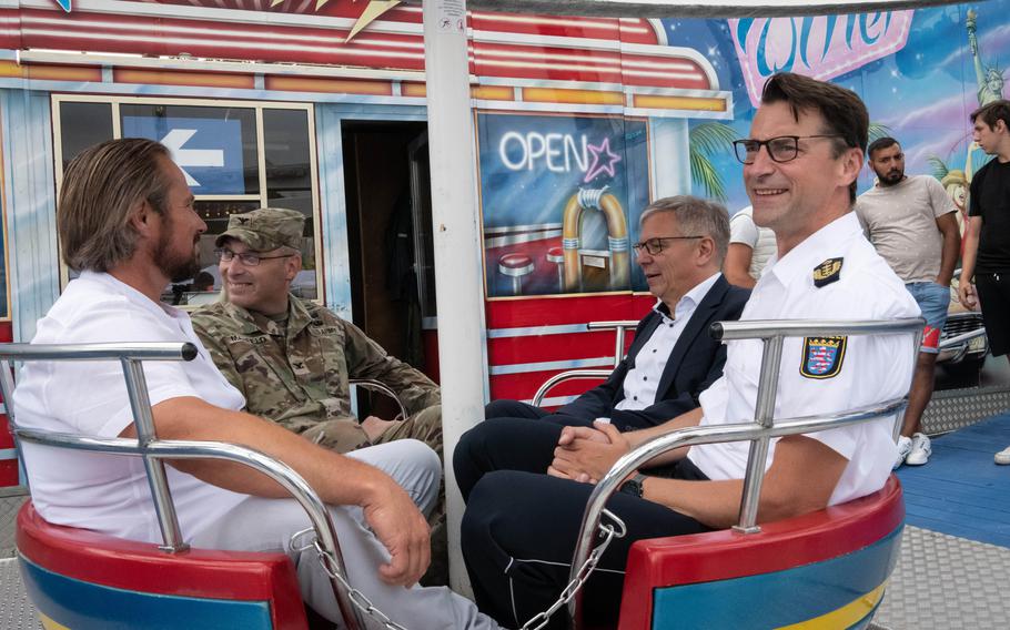 U.S. Army Garrison Wiesbaden commander Col. David Mayfield enjoys a ride with Wiesbaden dignitaries at the German-American Friendship Festival on June 29, 2023.