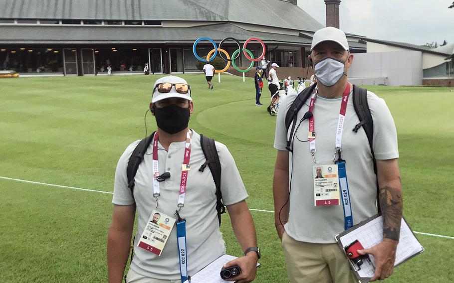 Tokyo Olympics volunteers Patrick Bowman, the golf professional at the Air Force-run Tama Hills Golf Course, and Jon Stillabower, operations manager at the Marine Corps’ Taiyo Golf Course on Okinawa, pose at Kasumigaseki Country Club in Saitama prefecture, Japan, Thursday, July 29, 2021. 